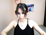 lili_magic sticking out tongue, standing and turning.