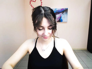 lili_magic sticking out tongue, standing and turning.