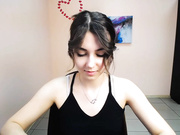 lili_magic sticking out tongue, standing and turning.