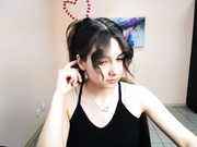 lili_magic sticking out tongue, standing and turning.