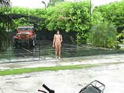 Girl dances in the rain naked