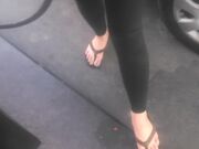 Asian cutie shows her feet at the gasstation