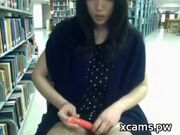 cute chinese girl uses vibrator in public library