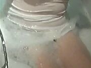 shy young teen wearing white dress in bath shows tits