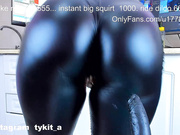 Tykit squirt in black latex leggings