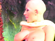 Bald Chick with Snakes, chains and piercings