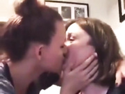 Mother and daughter kiss