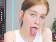 blonde non-nude shows her long tongue